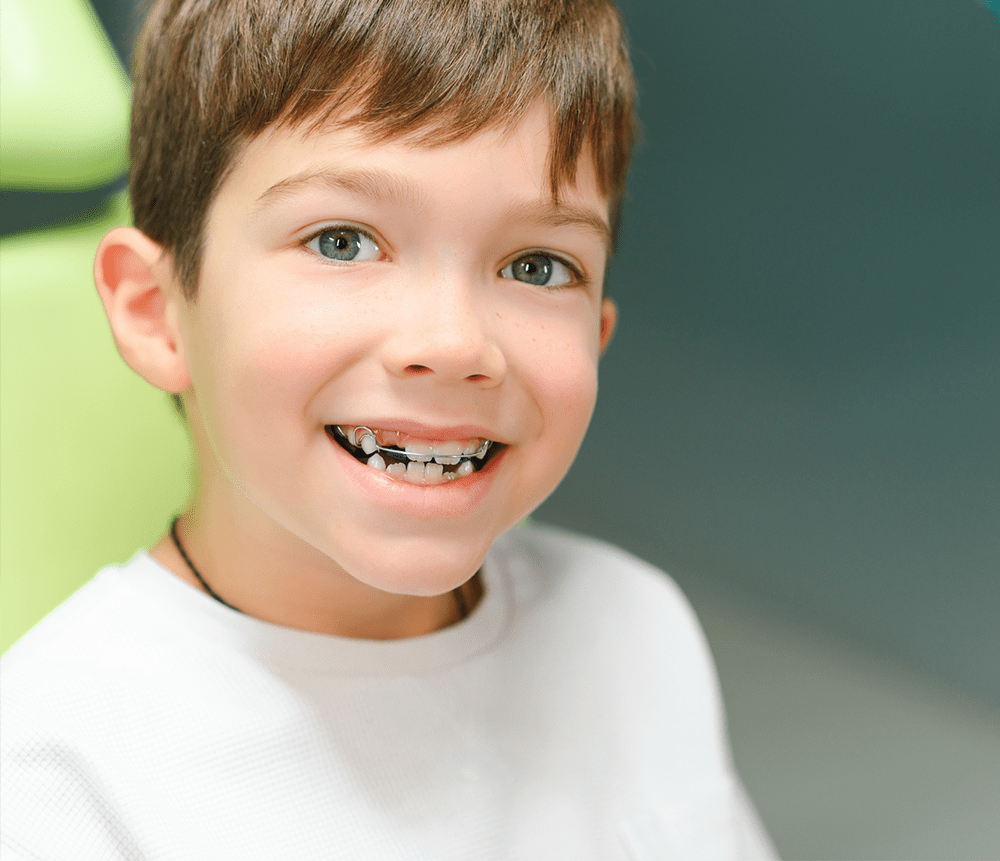 young patient smiling wearing braces